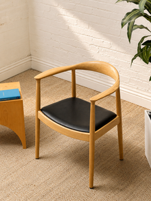 Modern Sculptural Oak Horseshoe Armchair with Black Seat