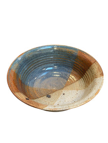 Multi-colored Glaze with Earthy tones, Including shades of Brown, White, and a Bluish-green.
