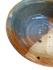 Multi-colored Glaze with Earthy tones, Including shades of Brown, White, and a Bluish-green.