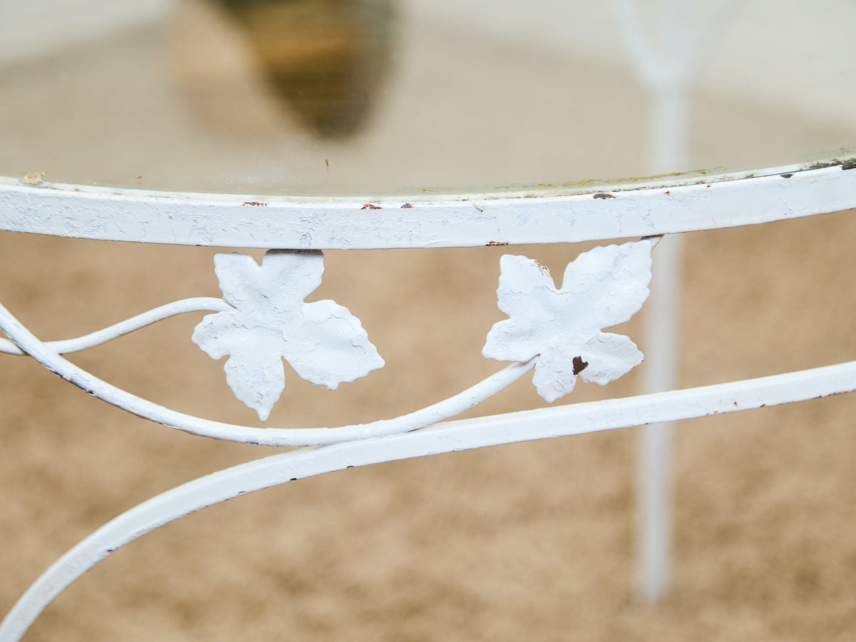 Vintage Wrought Iron Patio Dining Table with Leaf Motif Aqua Cushions and Glass Top