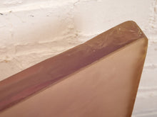 A vintage Textured Sculpture featuring an Indigenous Portrait Encased Resin