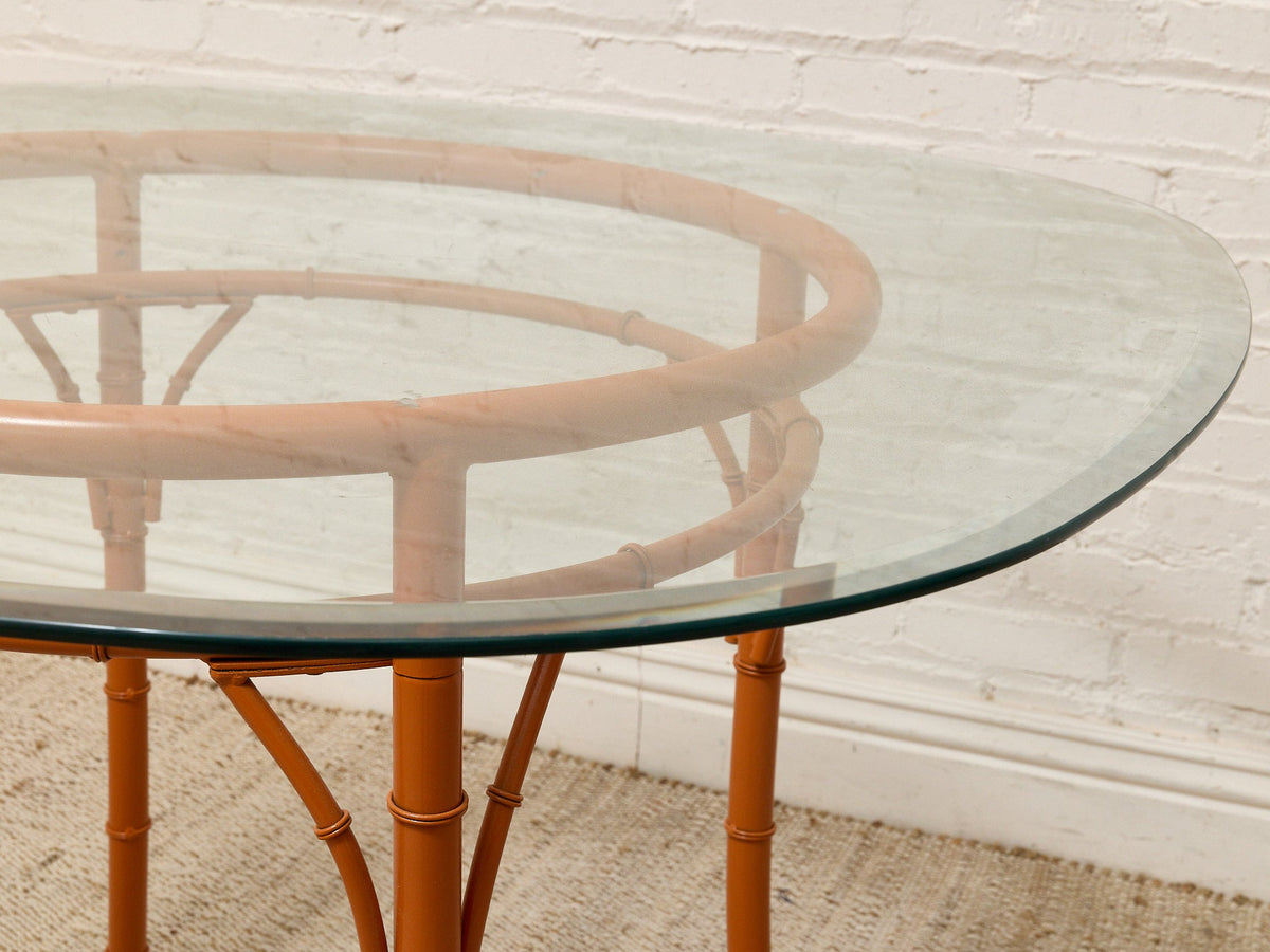 Vintage Bamboo-Style Orange Round Dining Table with Glass Top