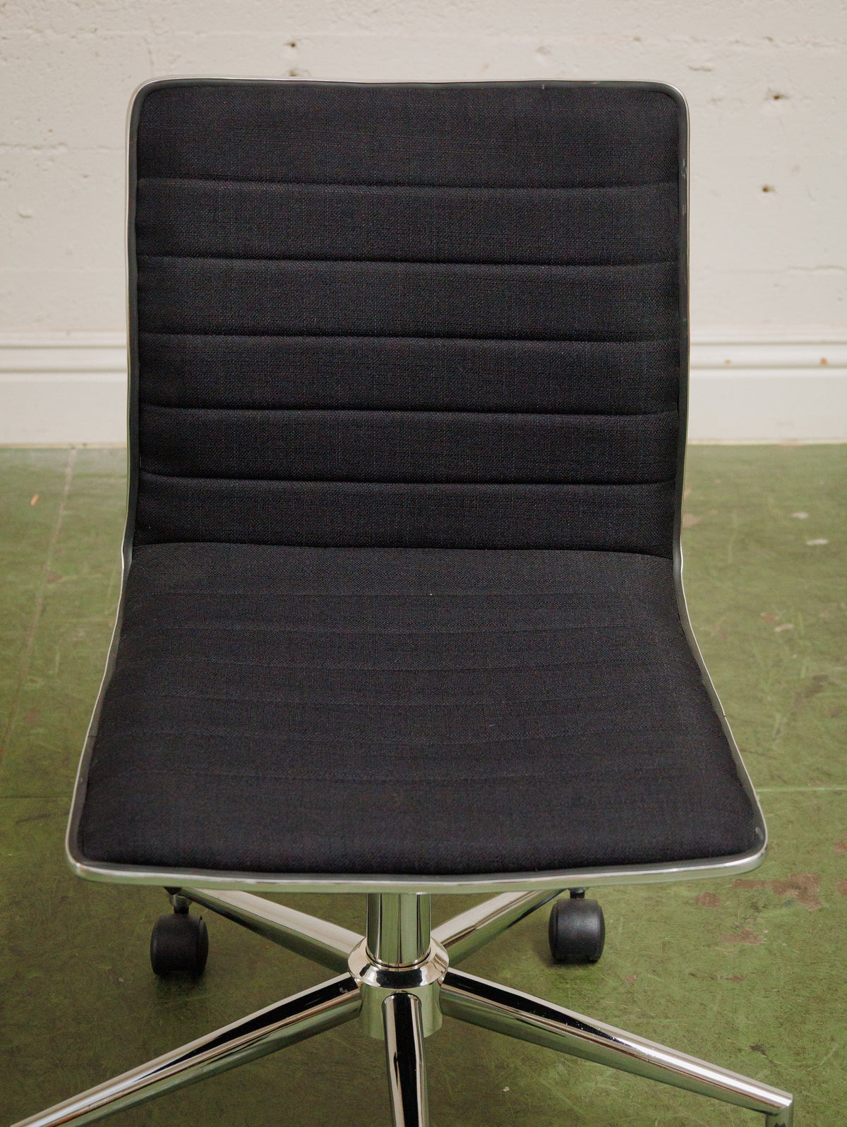 Armless Ribbed Swivel Office Chair in Black Upholstery