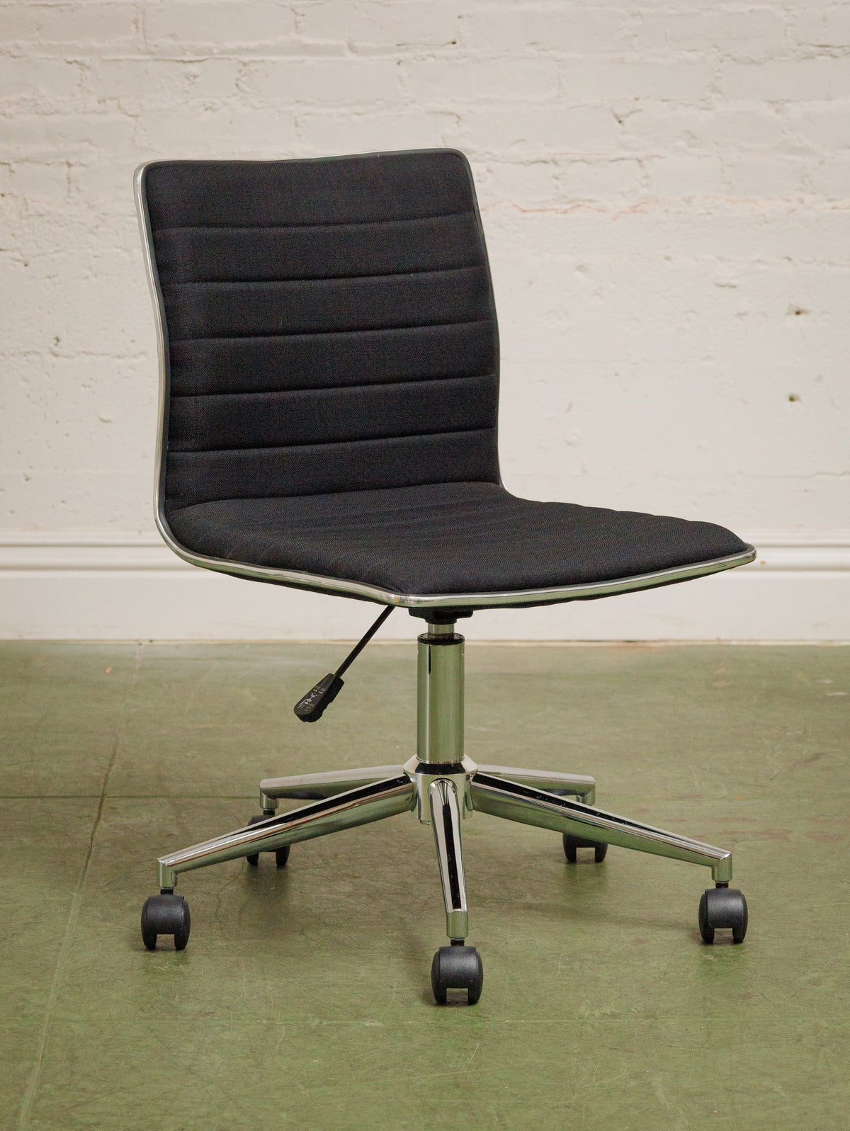 Armless Ribbed Swivel Office Chair in Black Upholstery