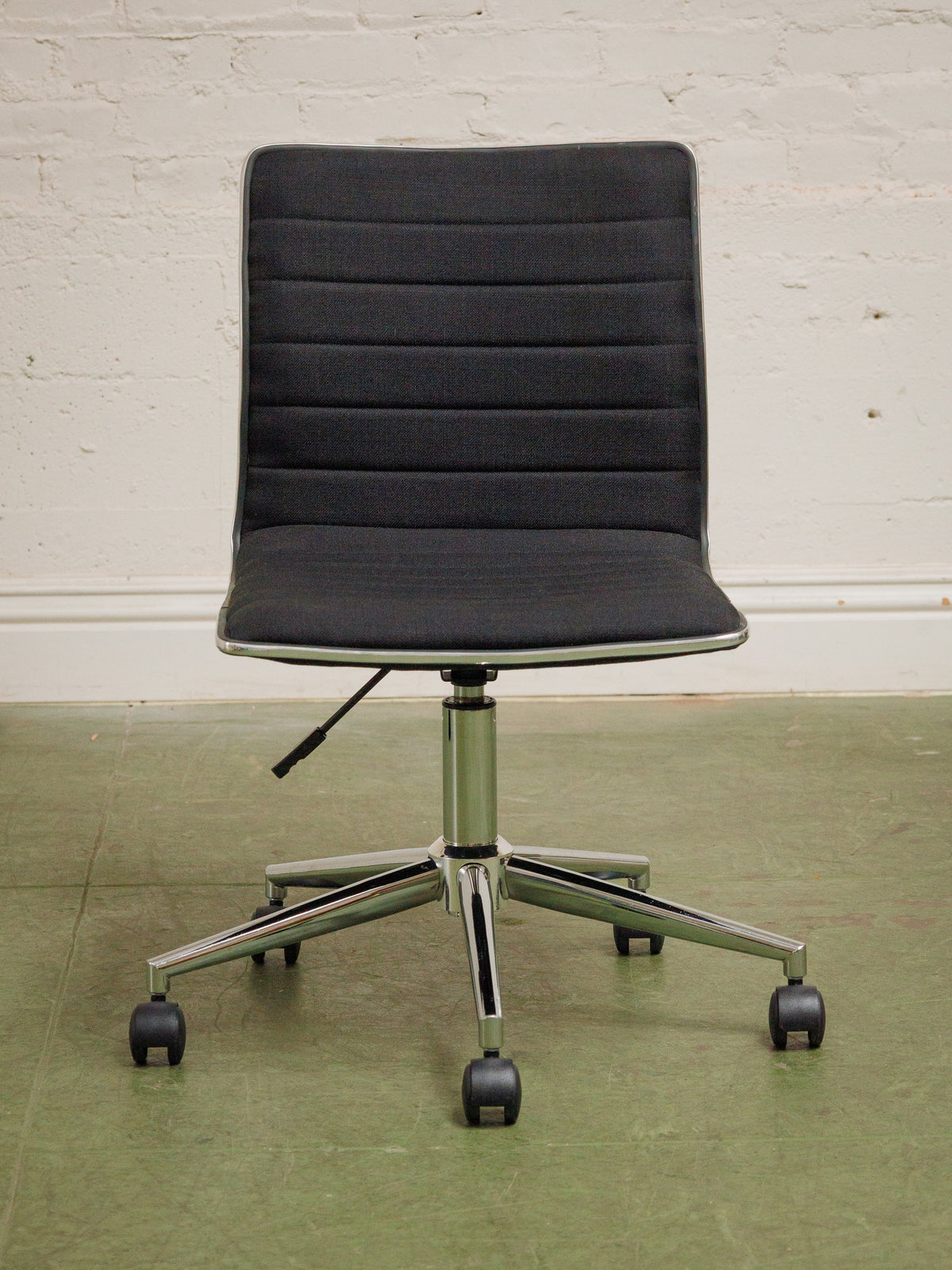 Armless Ribbed Swivel Office Chair in Black Upholstery